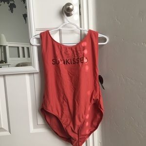 One piece swim suit. Never worn.